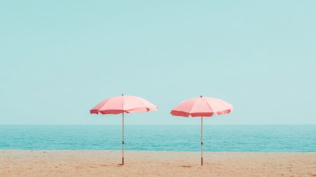 A serene beach scene featuring two pink umbrellas against a clear blue sky and calm ocean waves, perfect for summer vacation ads, travel brochures, or relaxation-themed projects,