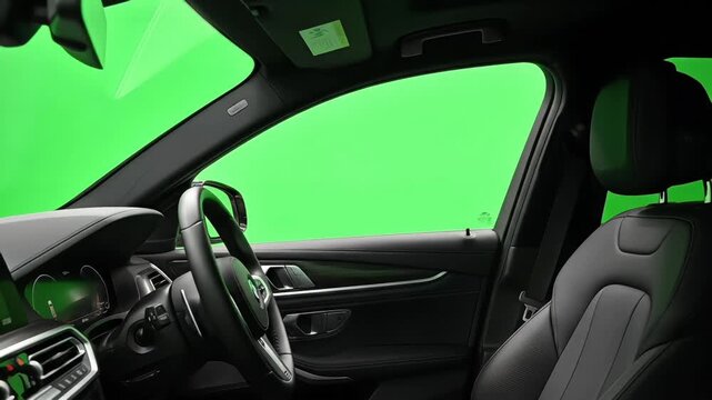 Interior vehicle view showing driver side window with flat green chroma surface. Perfect clean key edges allow easy compositing, scene replacement, and cinematic editing workflows