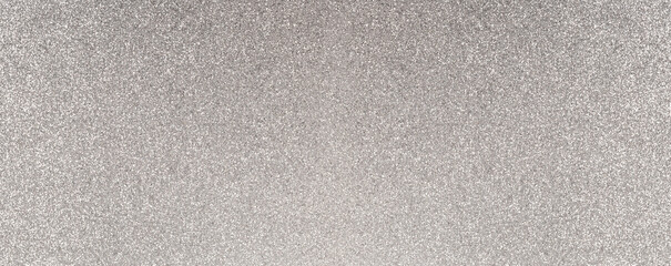 Fototapeta premium Silver glitter texture reflecting light on surface