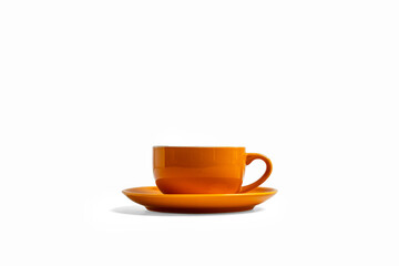 Obraz premium Side view orange coffee cup and saucer isolated on white background
