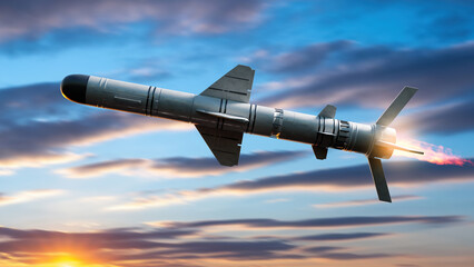 Defense industry, military technology. Cruise missile with jet engine flies through sky with exhaust flame during weapons test or combat mission at sunset.