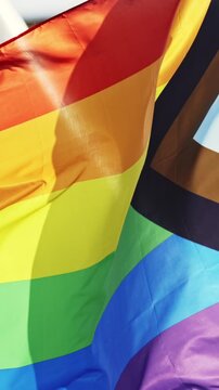 LGBT progress pride flag waving in the wind