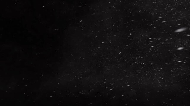 Realistic falling snow animation on black background, winter snowfall particles for cinematic Christmas and holiday season video overlays.