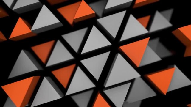 A 3D abstract geometric pattern with triangular shapes in orange and gray on a black backdrop