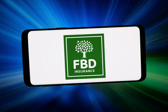Stuttgart, Germany - 02-16-2026: In this photo illustration, the logo of financial services company FBD Insurance is displayed on a smartphone in front of abstract background on computer screen.