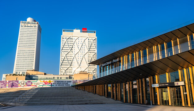 Saint Denis, France - December 29, 2025: Exterior view of the new Saint Denis Pleyel metro station and Tour Pleyel skyscraper. The modern transit hub is located near Paris with access to Metro Line 14