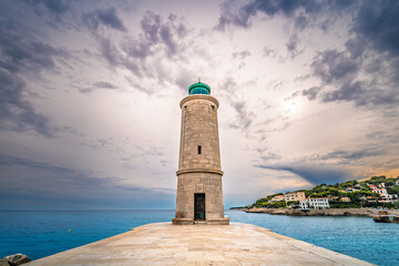 Scenic view of lighthouse in Cassis in south of France against dramatic sunset sky