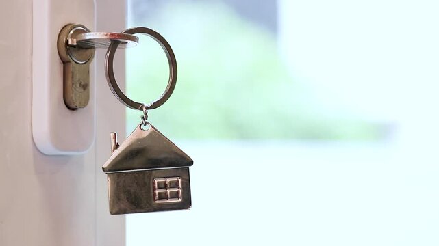 house-shaped keyring on the door lock