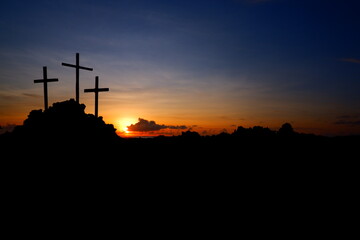 Naklejka premium three crosses on the hill at sunrise
