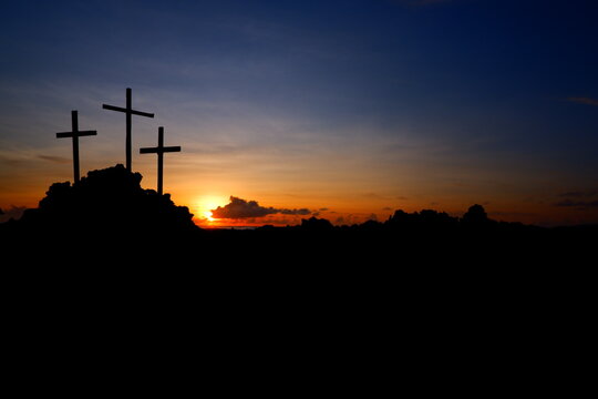 three crosses on the hill at sunrise