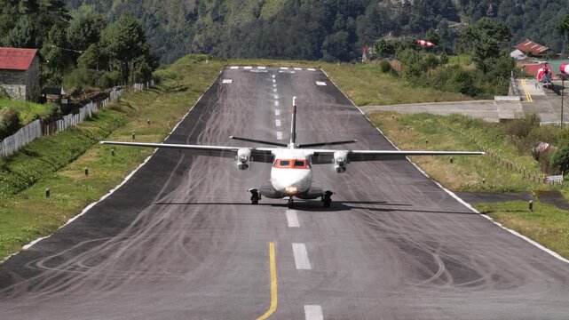 Aircraft on Lukla Airport runway in Lukla, Nepal