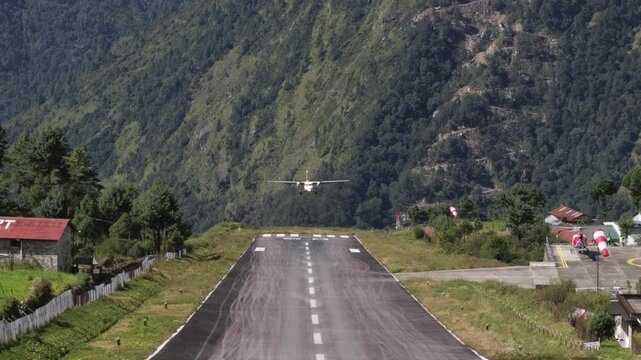 Airplane landing at Lukla Airport in Himalaya mountains, Nepal