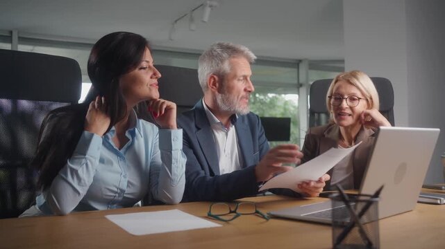 Multiracial business team discussing strategy in modern office meeting