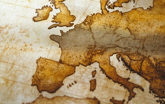Close-up aged sepia map of western Europe showing the Iberian Peninsula, France, Italy and British Isles on textured parchment with a nostalgic exploration mood