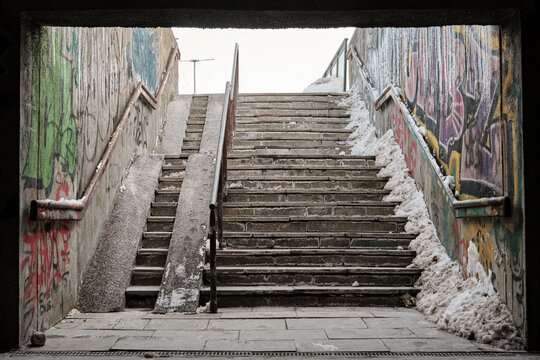 Underpass leading to the tram station in Gdansk, Poland covered with grafitti in the winter.