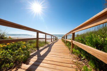 Obraz premium Wooden Boardwalk Stretching Towards the Ocean with Waves Under a Bright Sun
