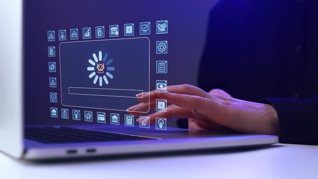 Technician works on laptop with software update process displaying on screen in an office setting during evening hours.