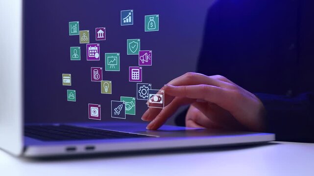 Hands typing on a laptop with digital icons showing various activities and metrics in a work environment at night.