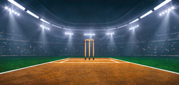 Cricket field at a sports stadium in foggy weather with shining floodlights and fans ready for an upcoming nighttime sports event.