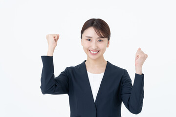 ガッツポーズをする若いビジネスウーマン