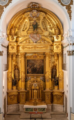 Caceres, Spain - 25 Nov 23: Gilded baroque altarpiece inside Iglesia de San Francisco Javier