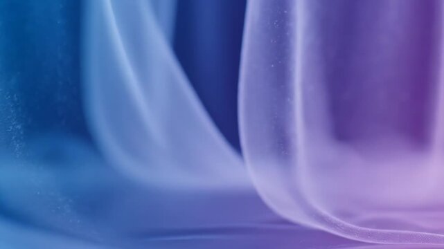 Abstract flowing fabric texture illuminated with cool neon lighting