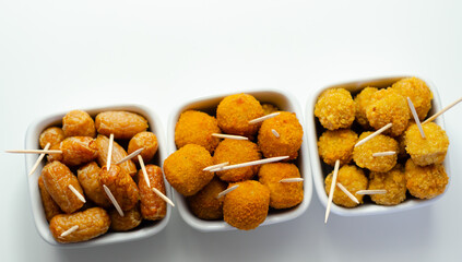Fototapeta premium Three bowls of food with different types of food and different shapes