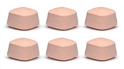 Fototapeta premium Close-up View of Six Soft Powder Tablets on a White Background