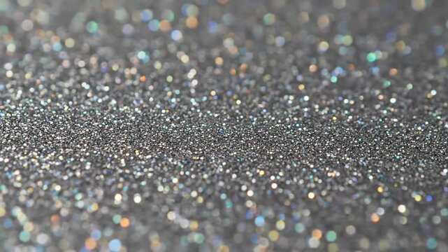 Dreamy Abstract Background An atmospheric shot where the monotone glitter forms an soft, out-of-focus, and blurred backdrop, creating a gentle bokeh effect ideal for overlays or serene, abstract