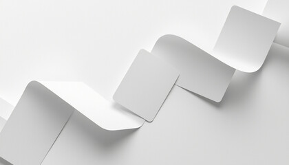 A close-up view of white paper cards arranged in a zigzag pattern on a plain background