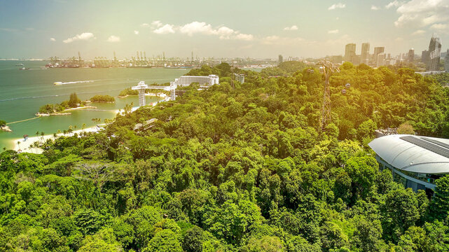 Panoramic aerial view of Sentosa Island from cable car with resorts and attractions below