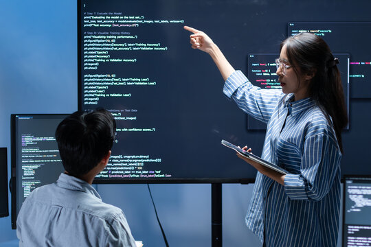 Asian Female Software Developer Manager Leader presenting Coding Software development application Project, Briefing solution to Programmer Team in Office. Coding Task, Ai Software Development Project.