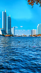 Bangkok, Thailand - December 15, 2019: Scenic view of Bangkok&rsquo;s riverside architecture along the Chao Phraya at sunset