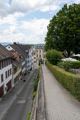 Fototapeta premium Quiet streets in the old town of Zug with historic buildings lined up along ancient city walls, empty alleys creating a calm and timeless atmosphere.