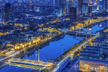 Tianjin City Night Skyline with Blue River and Illuminated Bridges