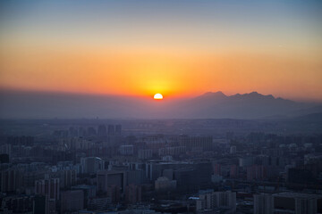 The Capital at Sunset - Urban Skyline with Mountain Backdrop