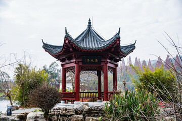 Traditional Chinese Pavilion at Jinggang Lake with Mountain Backdrop