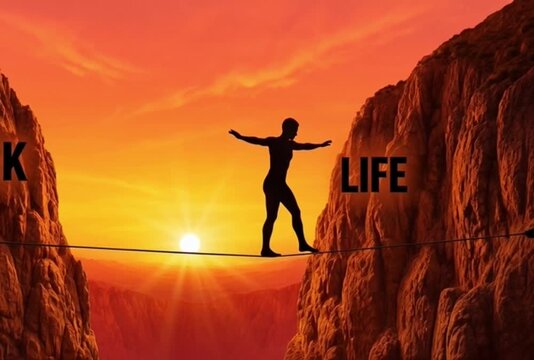 A man balancing work and life on a tightrope