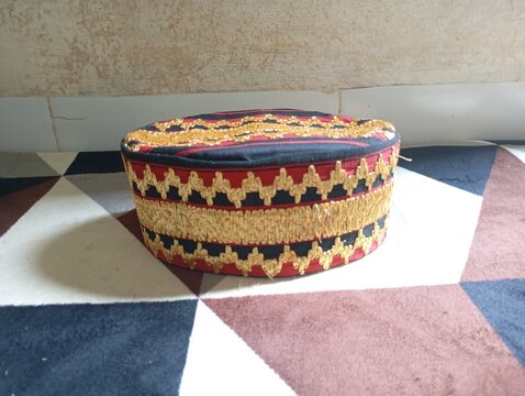 A kopiah or peci is a head covering that is often worn during worship.