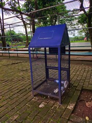 Metal cage recycle plastic bottles