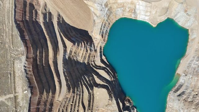 Aerial View of Open Pit Gold Mine with Blue Water Reservoir