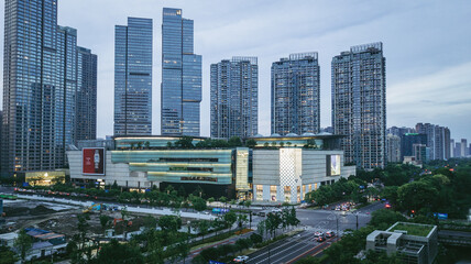 Modern Mall with Rooftop Garden in Bustling City Skyline © KimThi