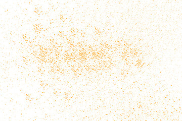 Orange Powder Particles Scattered Across White Surface.