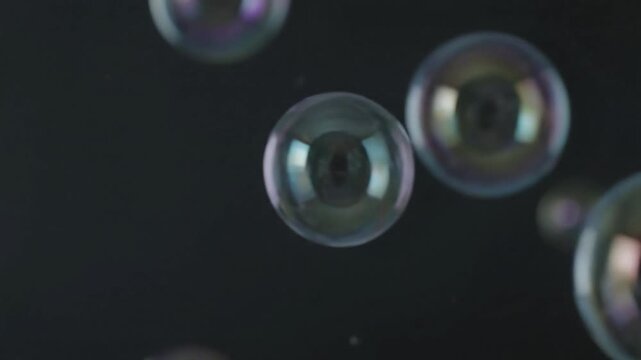 Dreamlike Suspension Capture the moments of near-stillness as bubbles momentarily hover or drift before continuing their slow, gradual rise, creating a sense of weightlessness and contemplation.