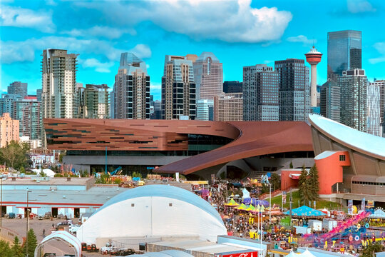 Calgary, Alberta, Canada. Feb 21, 2026. High-angle view of the BMO Centre expansion and Calgary Stampede grounds with the city skyline and Calgary Tower.