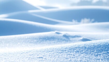 Snowy landscape with foggy mountains and cloudy sky viewed from a distance with serene atmosphere
