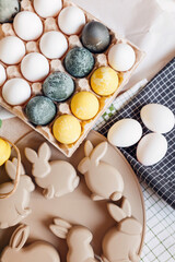 Colorful eggs and bunny plate for Easter celebration in a kitchen setting during spring holiday season