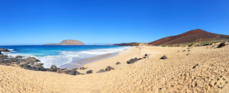 Beach Playa De Las Conchas with Montanas Clara and Bermeja, Island La Graciosa, Canary Islands, Spain, Europe. 