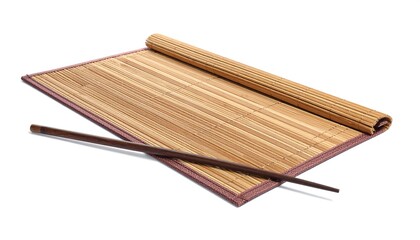 Close-up of a bamboo place mat, partially rolled, with chopsticks lying across it. The mat is framed with a border