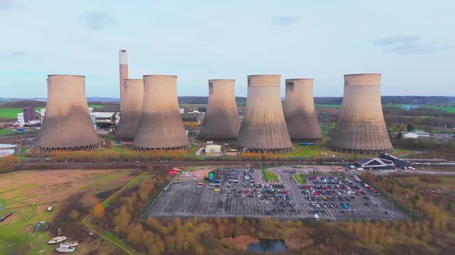 Pull out drone shot of cooling towers at a power plant in Ratcliffe on Soar, Nottinghamshire, UK